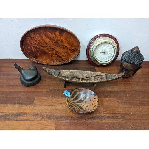 183 - Treen and resin to include a burr yew tray, a head, a paperweight and other items
Location: G
If the... 