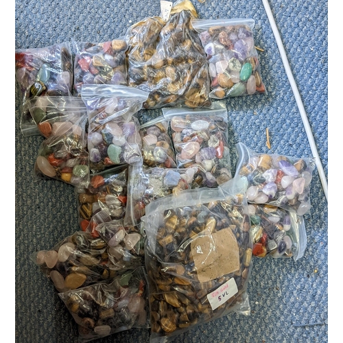 141 - Sixteen bags of semi precious stones to include tiger eye, aquamarine and others
Location:1.5
If the... 