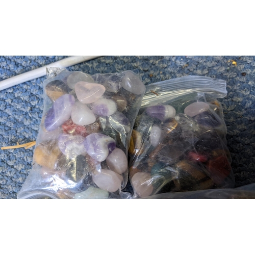 141 - Sixteen bags of semi precious stones to include tiger eye, aquamarine and others
Location:1.5
If the... 