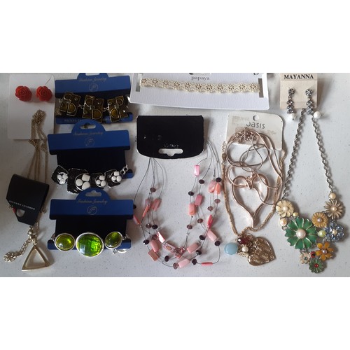 127 - A large quantity of modern and vintage fashion jewellery comprising unused High Street jewellery, mi... 