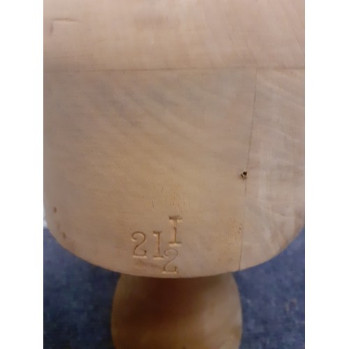 113 - A vintage milliner's wooden hat block stamped 21½ to the reverse and matching stand together with a ... 