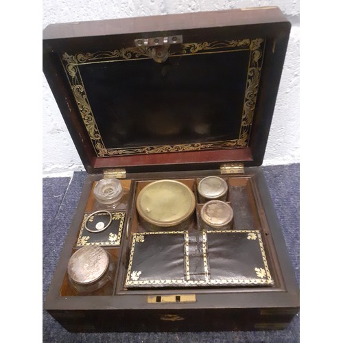 110 - A Victorian rosewood fitted vanity box and contents A/F. Location:T
Condition: The missing front bra... 