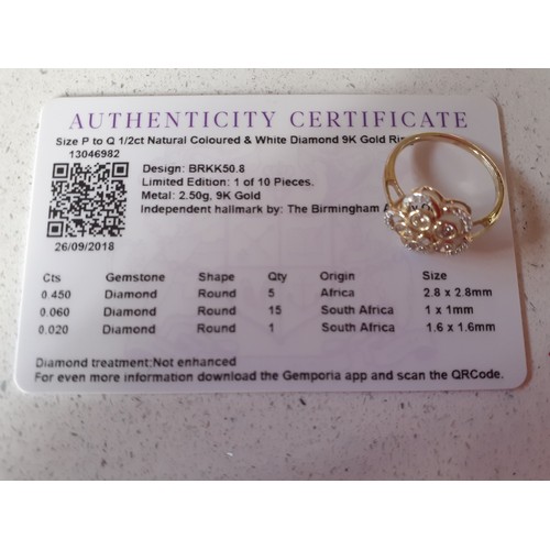 18 - A modern and limited edition 9ct gold dress ring with certificate of authenticity having a daisy des... 