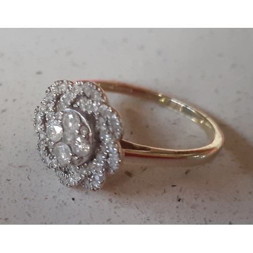 12 - A modern limited edition 9ct gold 'Tomas Rae' dress ring in a floral design with African diamonds, t... 