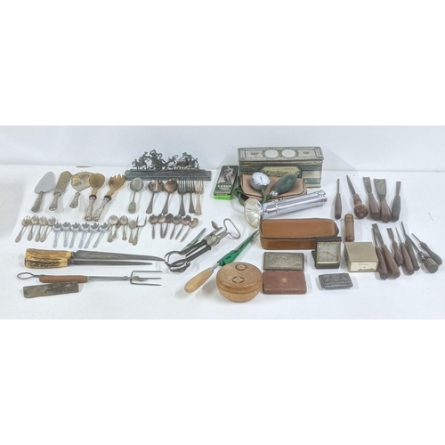 486 - A mixed lot to include vintage hand tools to include chisels, files and others along with silver pla... 