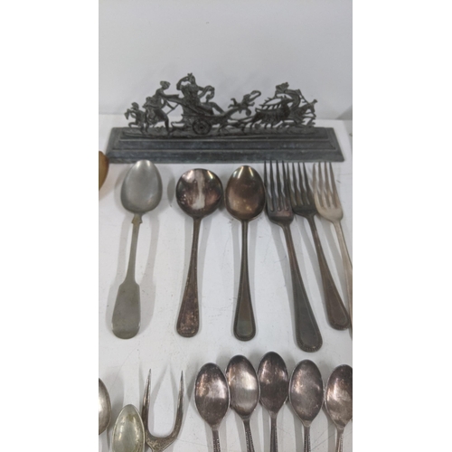 486 - A mixed lot to include vintage hand tools to include chisels, files and others along with silver pla... 