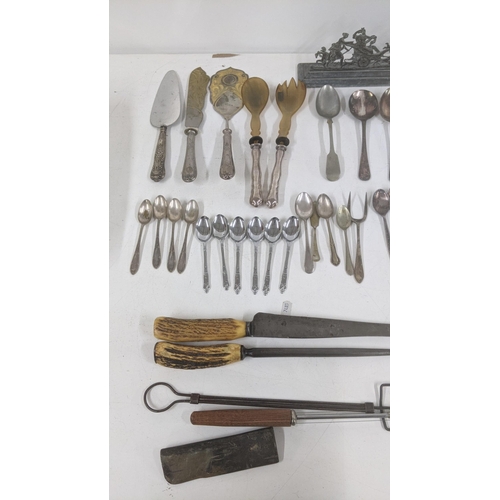 486 - A mixed lot to include vintage hand tools to include chisels, files and others along with silver pla... 