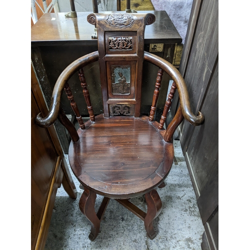 505 - A Chinese occasional chair, the scroll topped yoke shaped back forming a central carved and pierced ... 