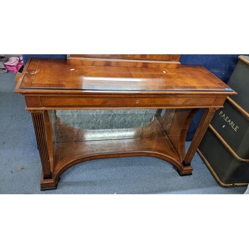 444 - A reproduction Biedermeier style mahogany hall table an matching mirror having cross banded veneer, ... 