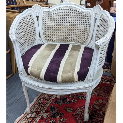 445 - A French bergère white painted armchair having can upholstery and scroll shaped arms
Location: RAM
I... 