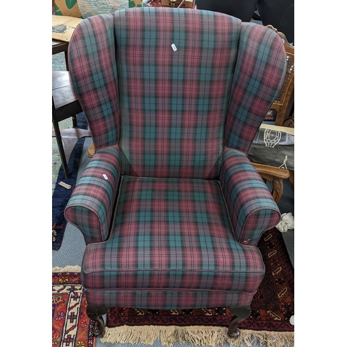 446 - A reproduction wingback armchair having tartan upholstery and mahogany cabriole legs
Location: A2B
I... 