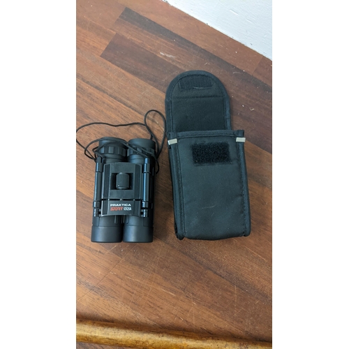 460 - Two horn handled walking sticks and a Praktica Sport 12 x 25A binoculars Location: STAIRS
If there i... 