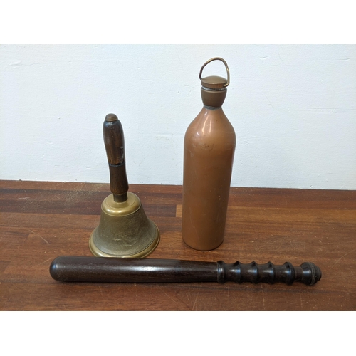 464 - A police truncheon, a brass bell and a hot water flask/bottle
Location: R2.1
If there is no conditio... 