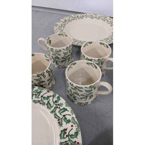 468 - An Emma Bridgewater Christmas set comprising four bowls, four mugs, four large plates and four small... 