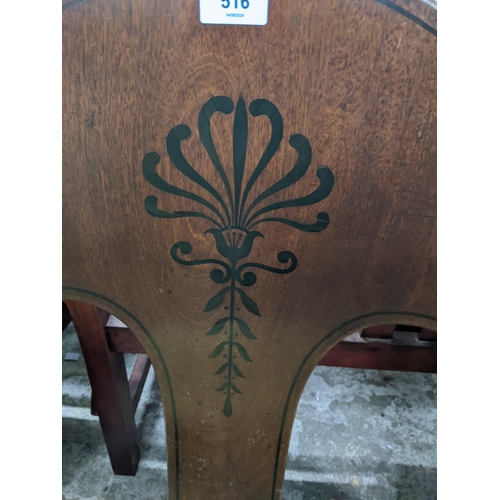 516 - A Victorian mahogany spoon back chair with inlaid floral decoration, upholstered seat on front forwa... 