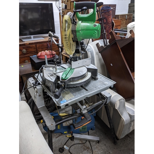 518 - A Hitachi C10FCE2 mitre saw, on an Elu work stand, along with a Record Power RPBS8 bandsaw Location:... 