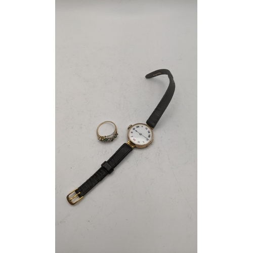 58 - A 9ct gold watch and a 9ct gold stone set ring. Featuring a mechanical wristlet with a 9ct gold case... 