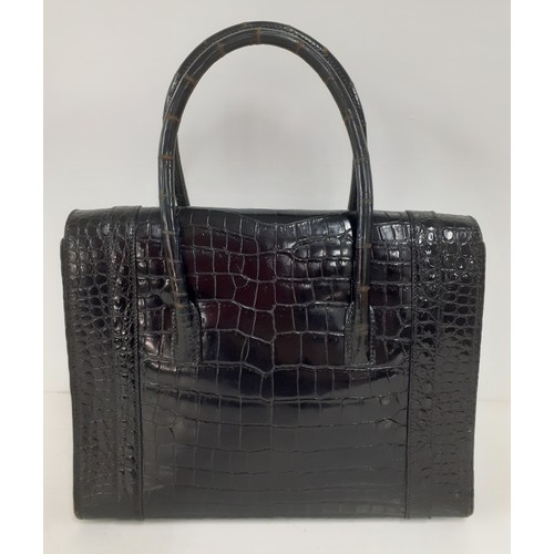 1 - Hermes- A 1970's black porosus crocodile 'Drag 26' handbag 26cm wide x 20cm high having gold tone ha... 