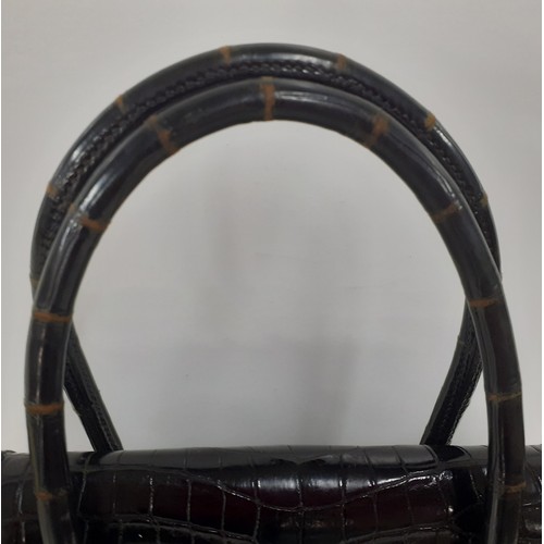 1 - Hermes- A 1970's black porosus crocodile 'Drag 26' handbag 26cm wide x 20cm high having gold tone ha... 