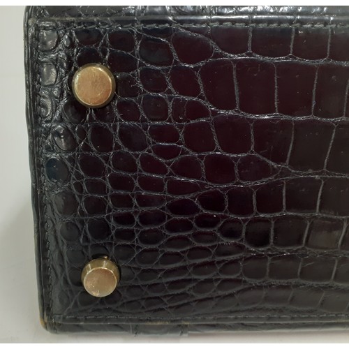 1 - Hermes- A 1970's black porosus crocodile 'Drag 26' handbag 26cm wide x 20cm high having gold tone ha... 