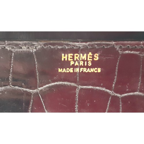 1 - Hermes- A 1970's black porosus crocodile 'Drag 26' handbag 26cm wide x 20cm high having gold tone ha... 