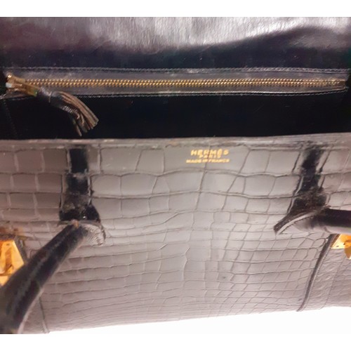 1 - Hermes- A 1970's black porosus crocodile 'Drag 26' handbag 26cm wide x 20cm high having gold tone ha... 