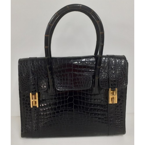 1 - Hermes- A 1970's black porosus crocodile 'Drag 26' handbag 26cm wide x 20cm high having gold tone ha... 