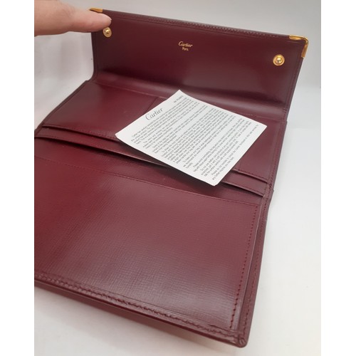 8 - Cartier- A Must de Cartier burgundy cowhide leather purse 19cm x 10cm with wallet and coin compartme... 