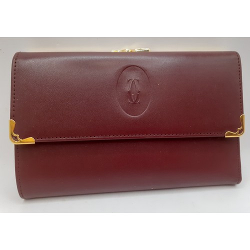 13 - Cartier- A Must de Cartier burgundy cowhide leather purse 15cm x 10cm with wallet and coin compartme... 