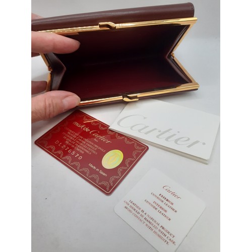 13 - Cartier- A Must de Cartier burgundy cowhide leather purse 15cm x 10cm with wallet and coin compartme... 