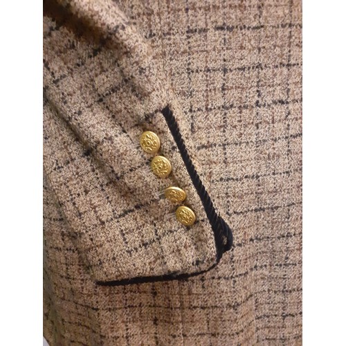 17 - Salvatore Ferragamo- A 1990's cream boucle wool and silk mix fitted jacket having 4 gold tone button... 