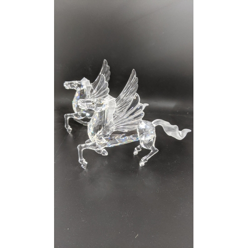 436 - ***THIS LOT HAS BEEN WITHDRAWN***Two boxed Swarovski Crystal Pegasus models Location:
If there is no... 