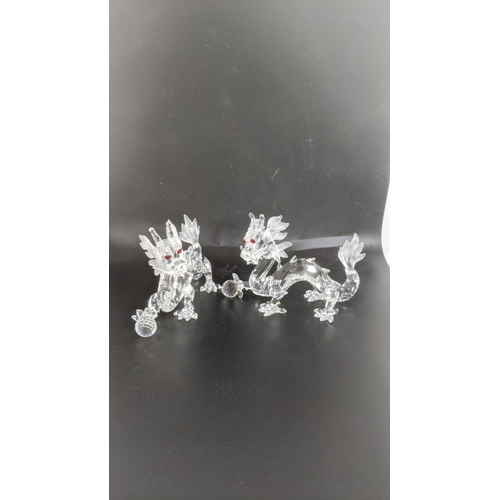 439 - ***THIS LOT HAS BEEN WITHDRAWN***Two boxed Swarovski Crystal dragons Location:
If there is no condit... 