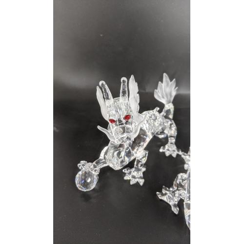 439 - ***THIS LOT HAS BEEN WITHDRAWN***Two boxed Swarovski Crystal dragons Location:
If there is no condit... 