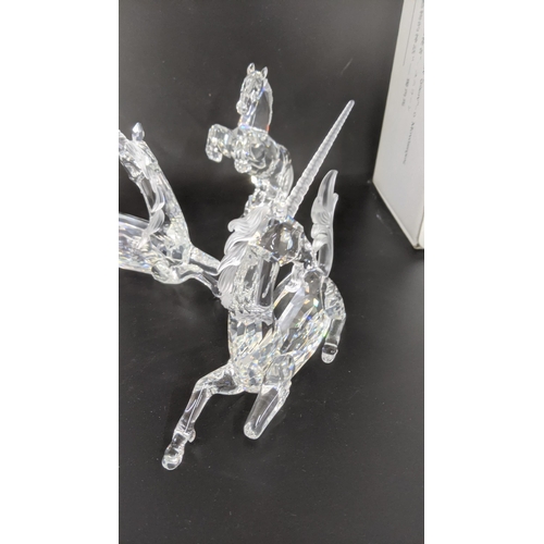 440 - ***THIS LOT HAS BEEN WITHDRAWN***Three boxed Swarovski Crystal examples to include a pair of Unicorn... 