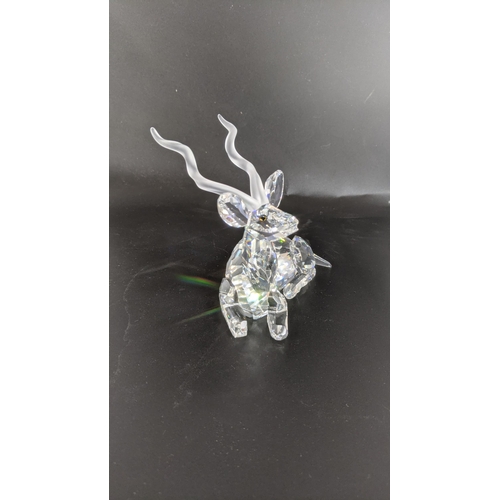 441 - ***THIS LOT HAS BEEN WITHDRAWN***Three boxed Swarovski Crystal examples to include a Buffalo, Kudu G... 