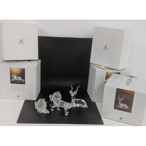 442 - ***THIS LOT HAS BEEN WITHDRAWN***Four boxed Swarovski Crystal examples to include a pair of Lions, a... 