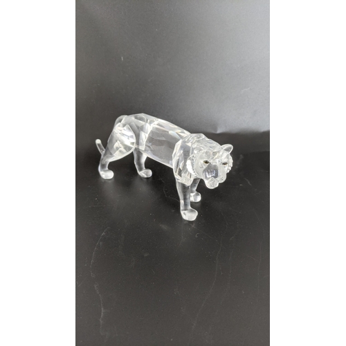 442 - ***THIS LOT HAS BEEN WITHDRAWN***Four boxed Swarovski Crystal examples to include a pair of Lions, a... 