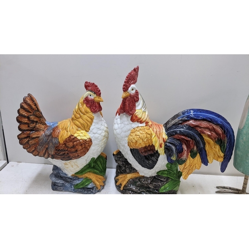 500 - A pair of porcelain models of cockerels, together with a large metal model of a cockerel Location:SL... 