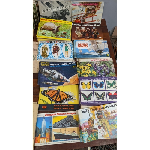 455 - A collection of collectors cards in books and various cigarette cards to include National Flags & Ar... 