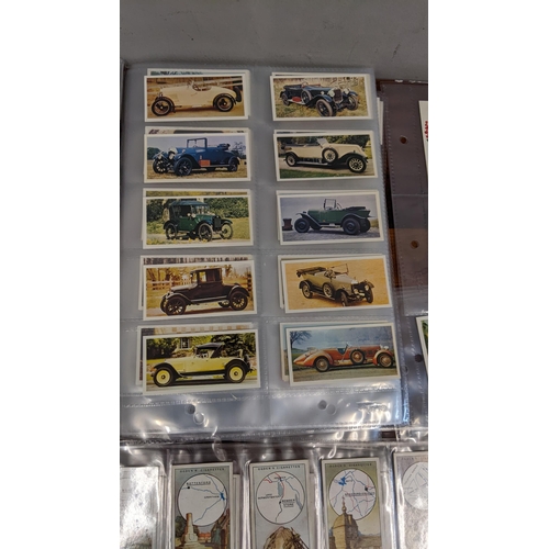 455 - A collection of collectors cards in books and various cigarette cards to include National Flags & Ar... 