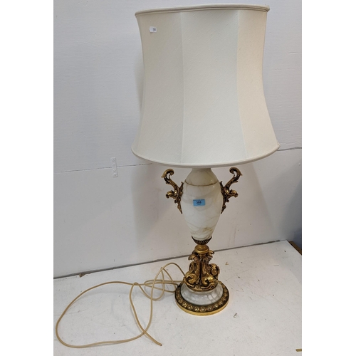 471 - A mid 20th century gilt metal and alabaster Italian style lamp, decorated with fish, 63cm h
Location... 