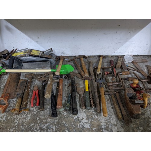 492 - A mixed lot of tools and gardening tools including a trolley jack, hobby fretsaw, spades, vintage sa... 