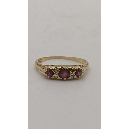 106 - A yellow gold ring set with ruby and diamonds tested as 18ct gold purchased in Singapore 2.7g
Locati... 