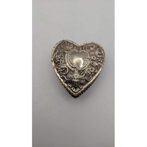 109 - A silver heart shaped trinket box having floral embossed decoration hallmarked London 1887, 109.3g
L... 