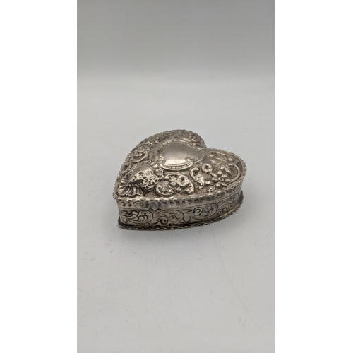 109 - A silver heart shaped trinket box having floral embossed decoration hallmarked London 1887, 109.3g
L... 