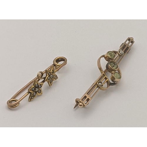 11 - Two 9ct gold bar brooches to include one example set with peridot and seed pears, along with one oth... 