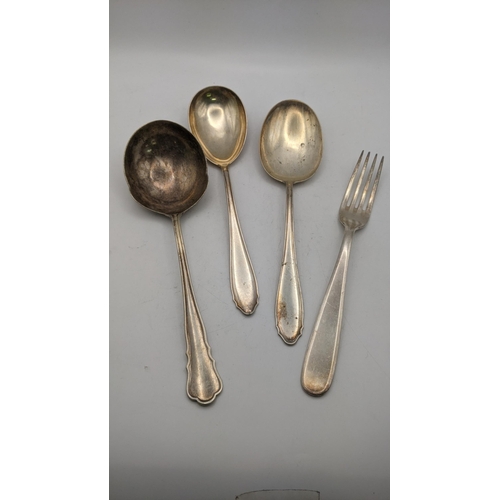 117 - silver and white metal stamped 800 to include three serving spoons and a fork, total weight 283.8g
L... 