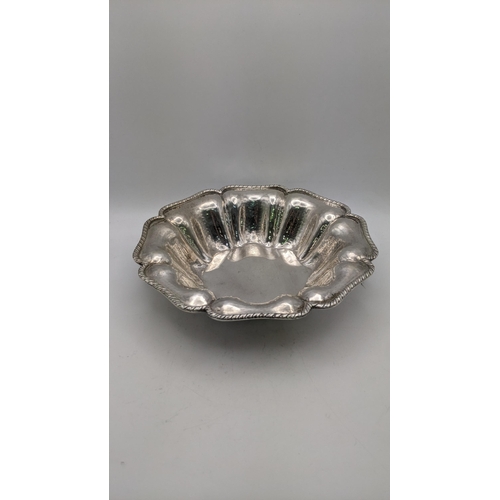 123 - A silver bowl stamped 800 having a gadrooned shaped rim and hammered decoration 239.7g
Location: R2-... 