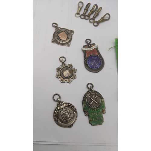 129 - A selection of 5 silver fobs to include fobs relating to darts competitions and others total weight ... 